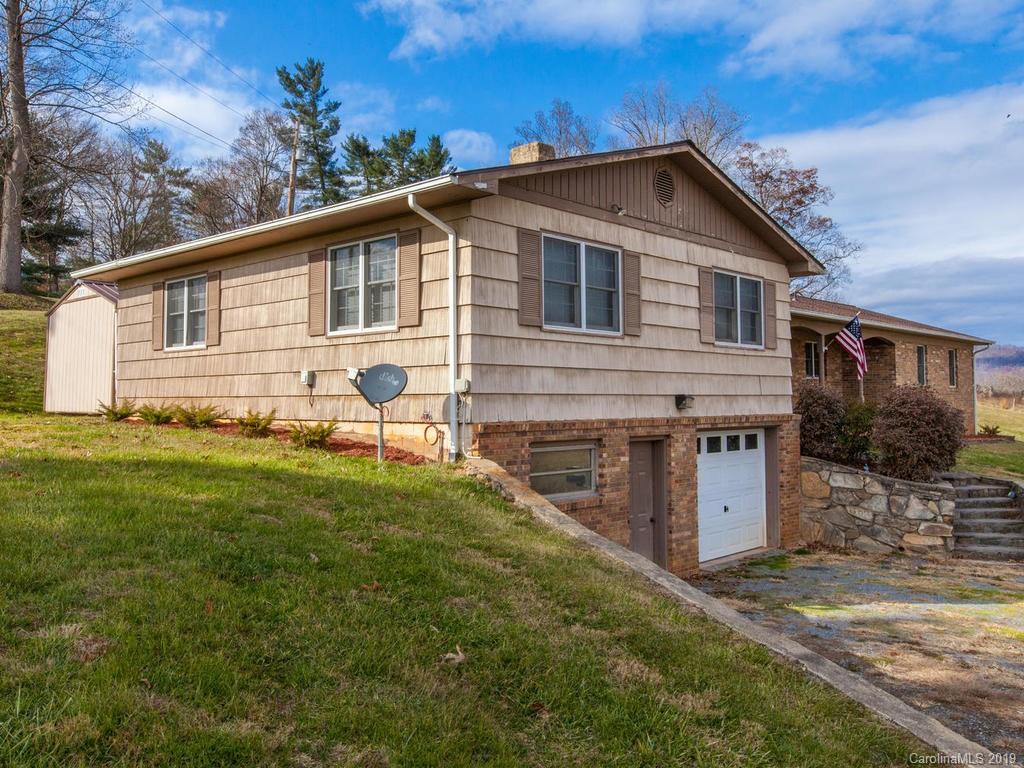 2533 Iron Duff Road Waynesville, NC 28785 - Photo 2 of 35 a front view of a house with garden