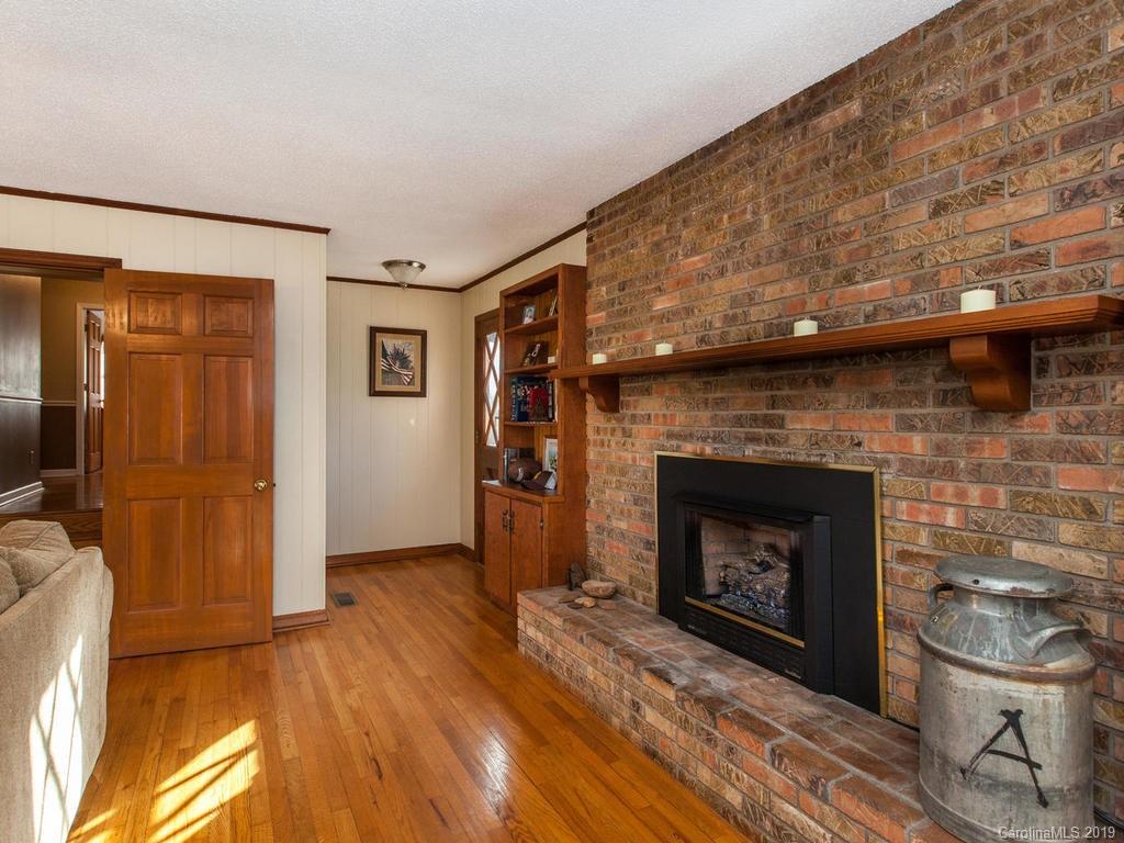 2533 Iron Duff Road Waynesville, NC 28785 - Photo 13 of 35 a room with a fireplace
