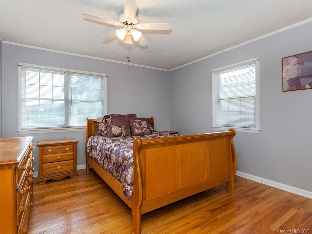 2533 Iron Duff Road Waynesville, NC 28785 - Photo 17 of 35 a bed room with a bed and a window