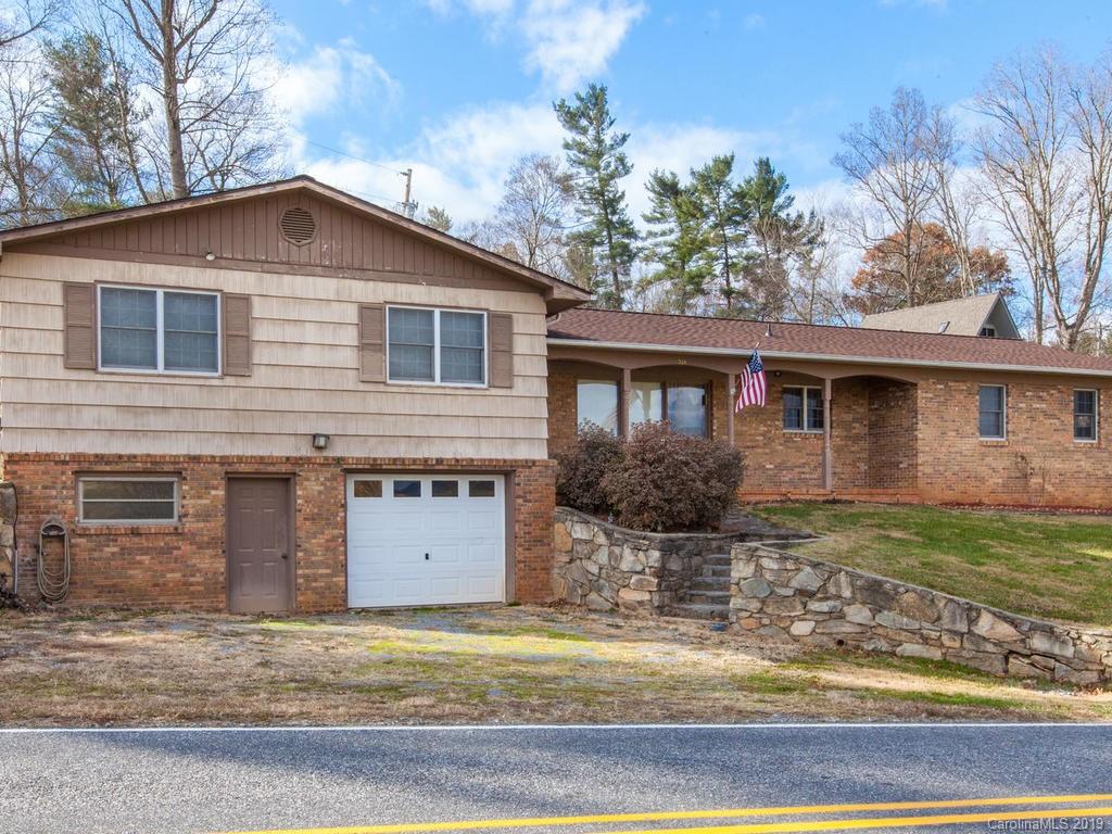 2533 Iron Duff Road Waynesville, NC 28785 - Photo 3 of 35 a front view of a house with garden