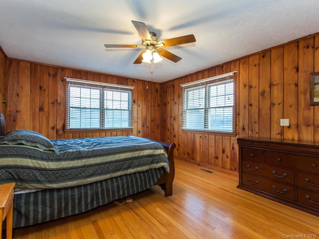 2533 Iron Duff Road Waynesville, NC 28785 - Photo 21 of 35 a bed sitting in a room next to a window