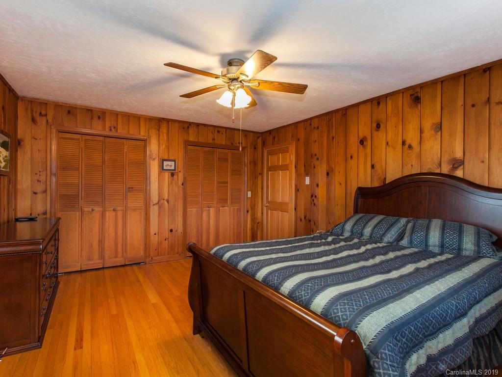 2533 Iron Duff Road Waynesville, NC 28785 - Photo 23 of 35 a bedroom with a bed and a closet