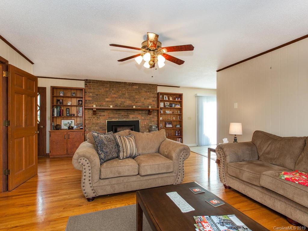 2533 Iron Duff Road Waynesville, NC 28785 - Photo 10 of 35 a living room with furniture and a fireplace