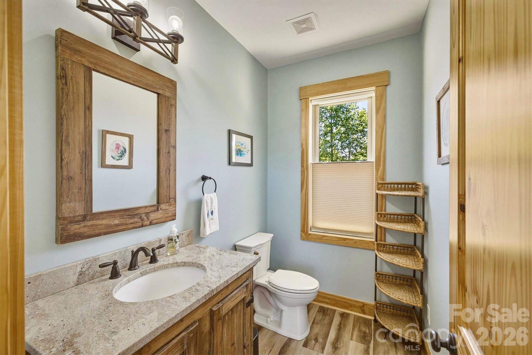 5564 Table View Lane Lenoir, NC 28645 - Photo 18 of 48 a bathroom with a granite countertop sink toilet and shower
