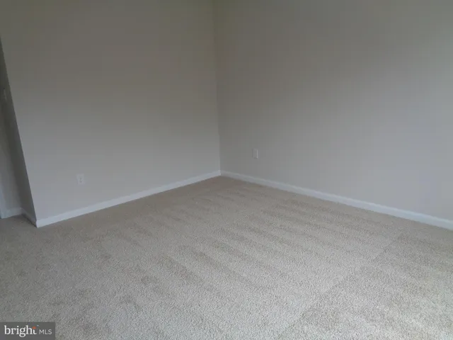 a bathroom with a double vanity sink and mirror