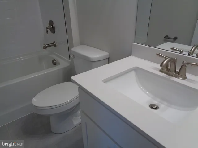 a view of an empty room with stairs