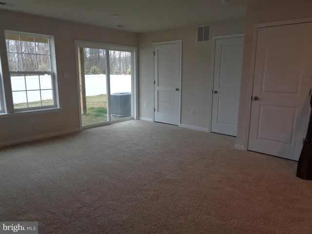 a view of an empty room with stairs
