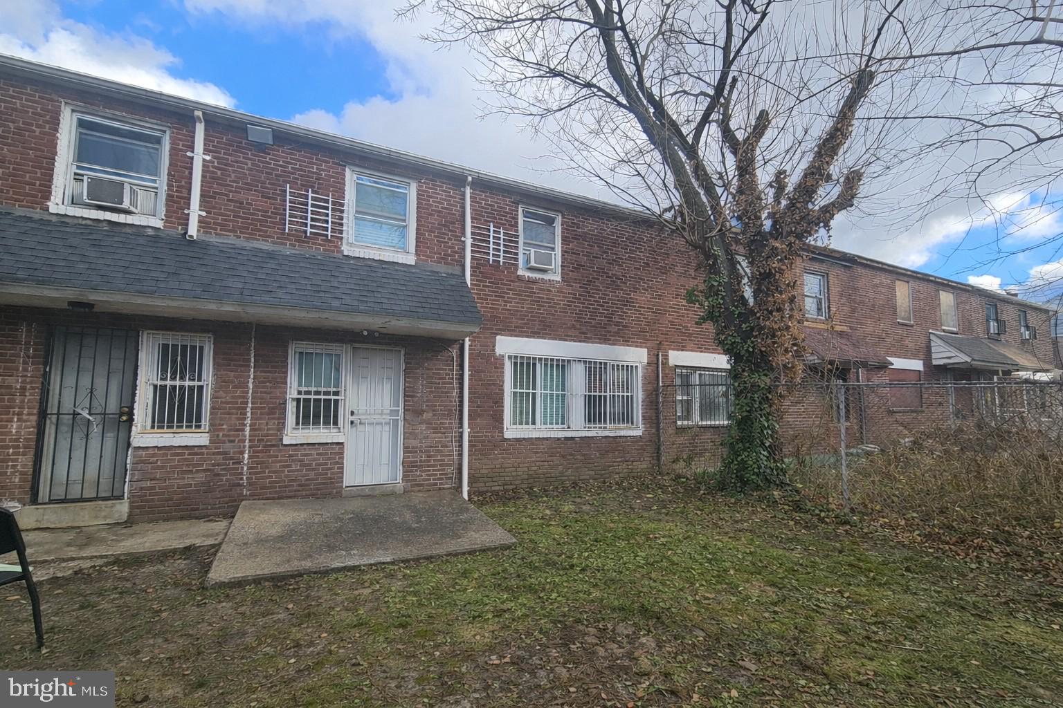 1436 Perkins Street Chester, PA 19013 - Photo 10 of 10 a front view of a house with yard and trees