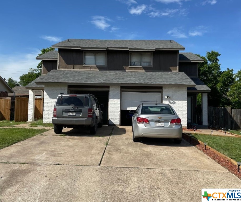 a car parked in front of a house