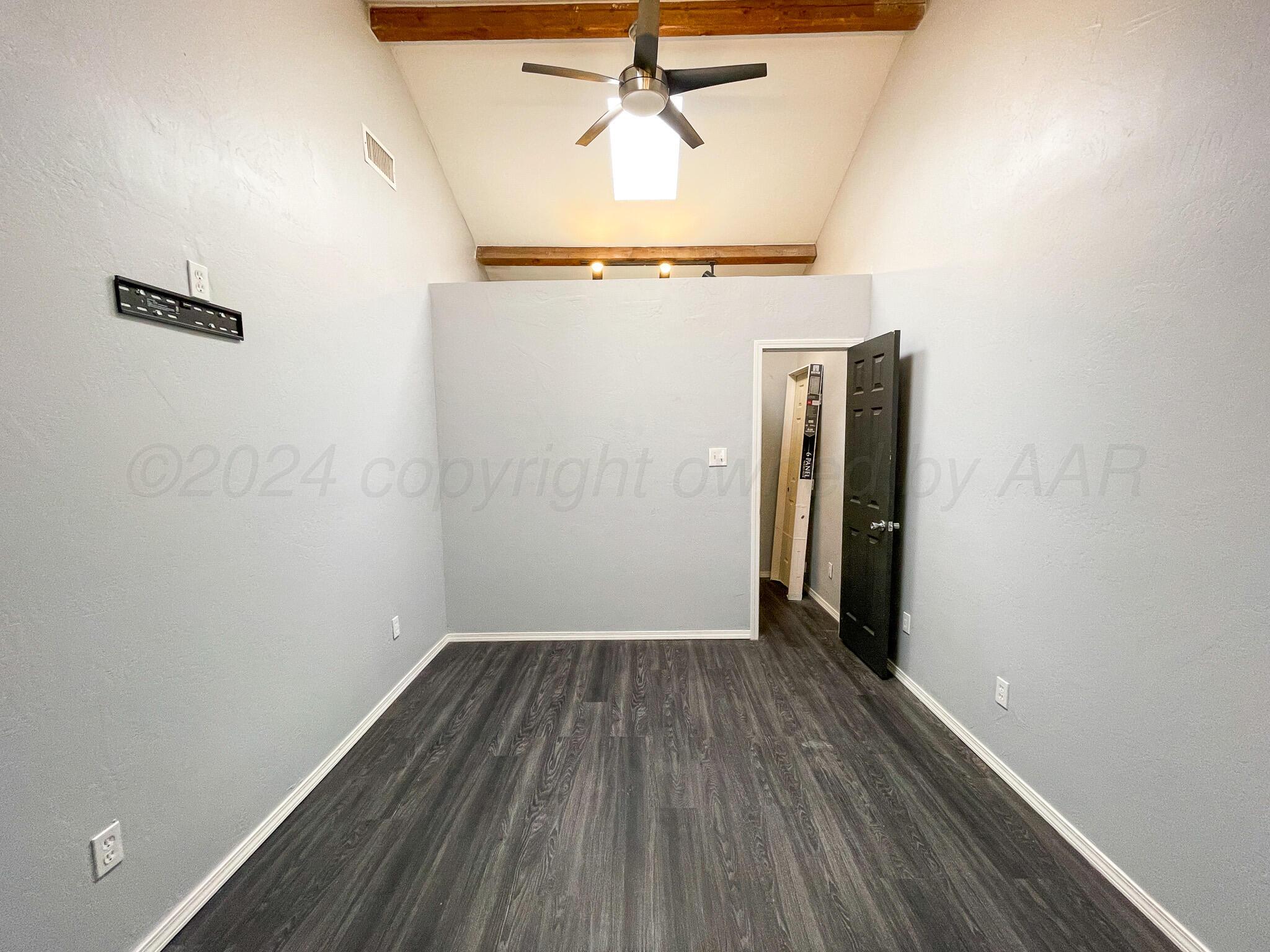 4110 South Lipscomb Street Amarillo, TX 79110 - Photo 14 of 16 a view of a hallway with wooden floor
