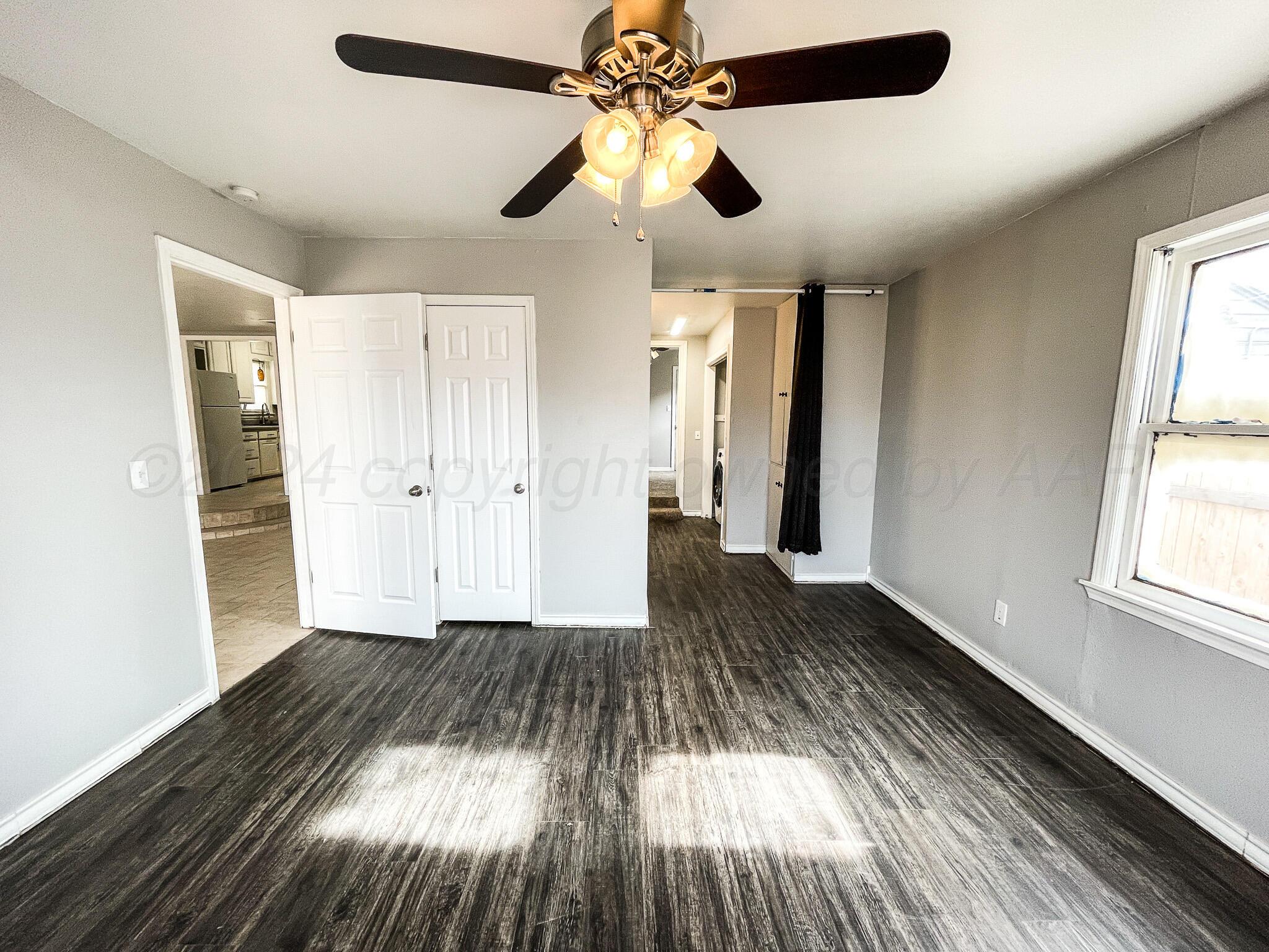 4110 South Lipscomb Street Amarillo, TX 79110 - Photo 8 of 16 a view of empty room with wooden floor and fan