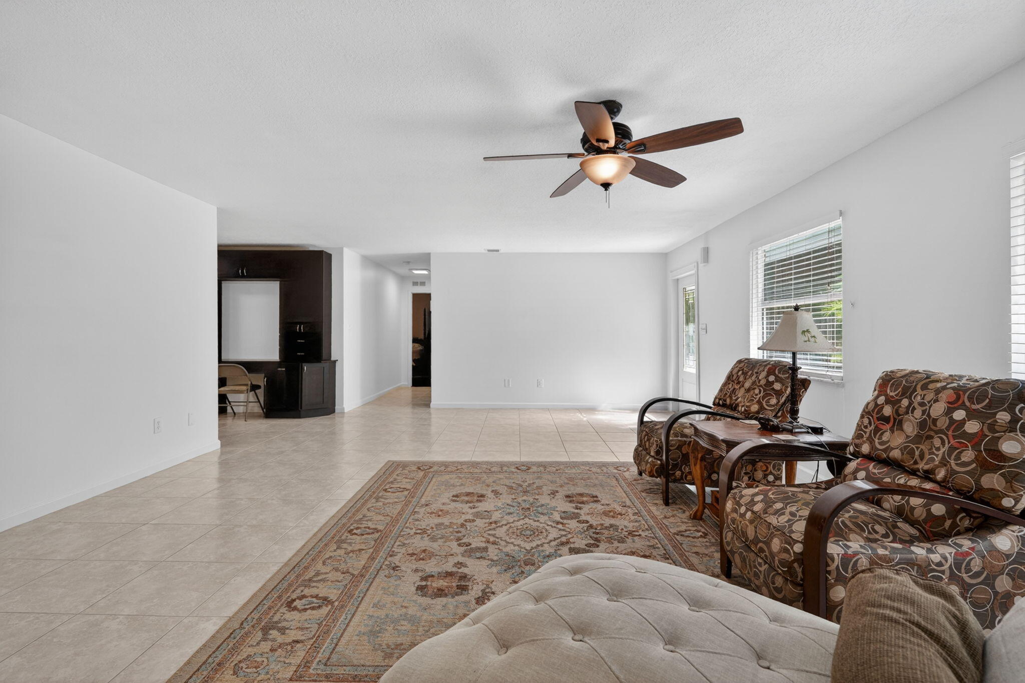 17391 Alexander Run Jupiter, FL 33478 - Photo 5 of 55 a living room with furniture and a rug
