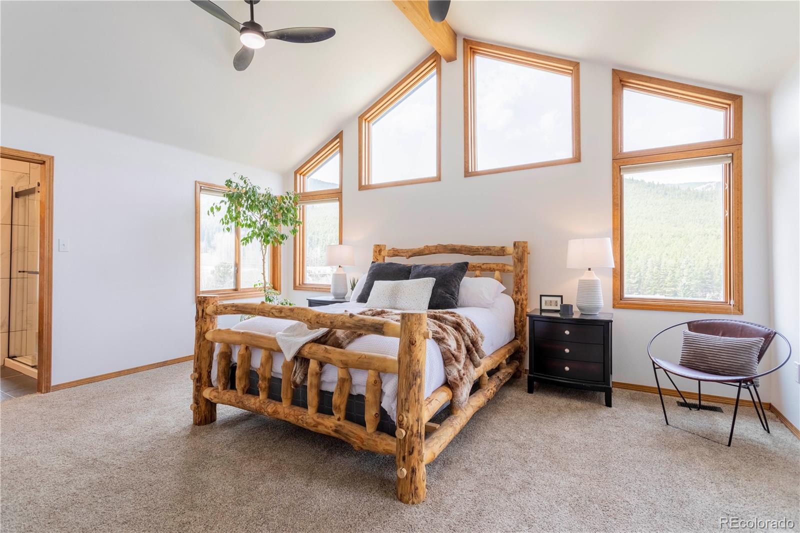 152 Bear Drive Golden, CO 80403 - Photo 13 of 40 a bedroom with a bed chair and a window