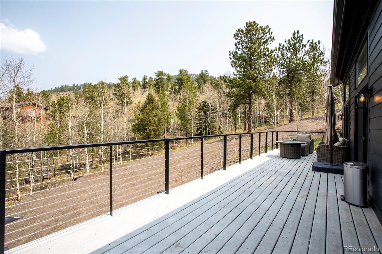 152 Bear Drive Golden, CO 80403 - Photo 20 of 40 a view of balcony with wooden floor and fence