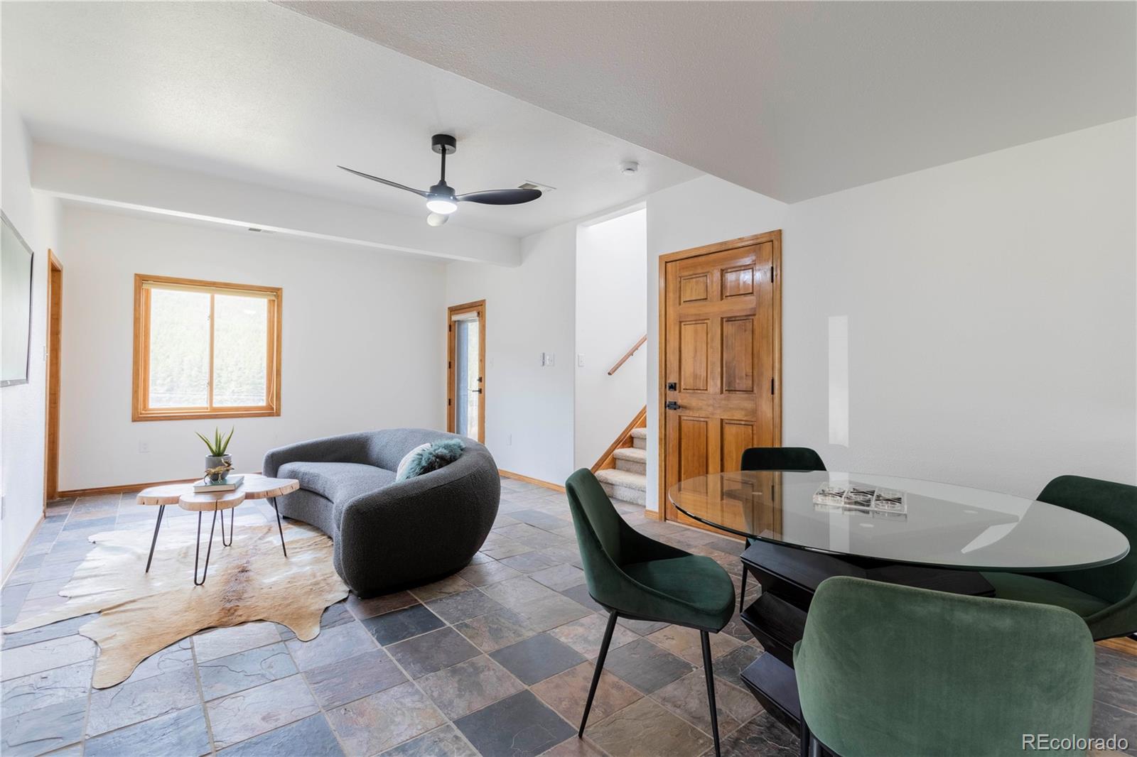 152 Bear Drive Golden, CO 80403 - Photo 21 of 40 a living room with furniture a window and a table