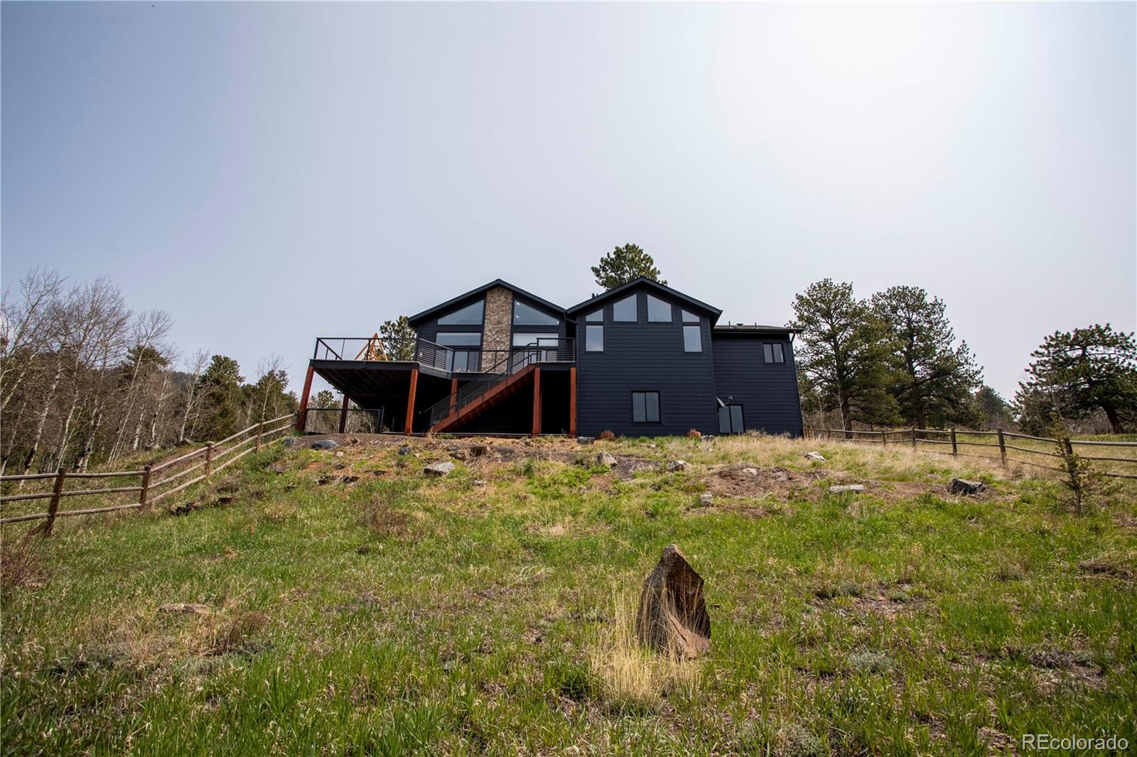 152 Bear Drive Golden, CO 80403 - Photo 28 of 40 a view of a house with a yard
