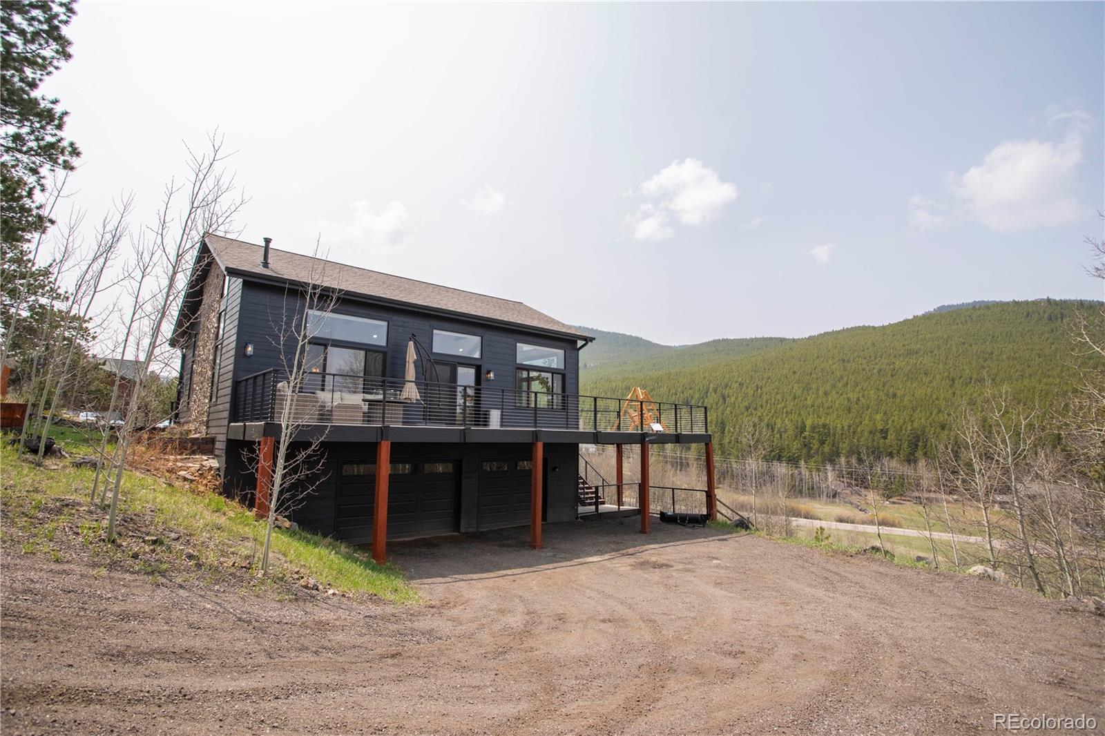 152 Bear Drive Golden, CO 80403 - Photo 29 of 40 a front view of a house with a yard