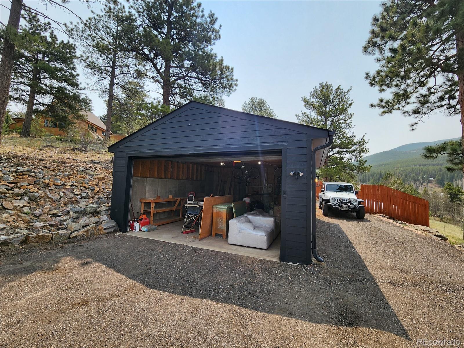 152 Bear Drive Golden, CO 80403 - Photo 32 of 40 a view of a house with a patio