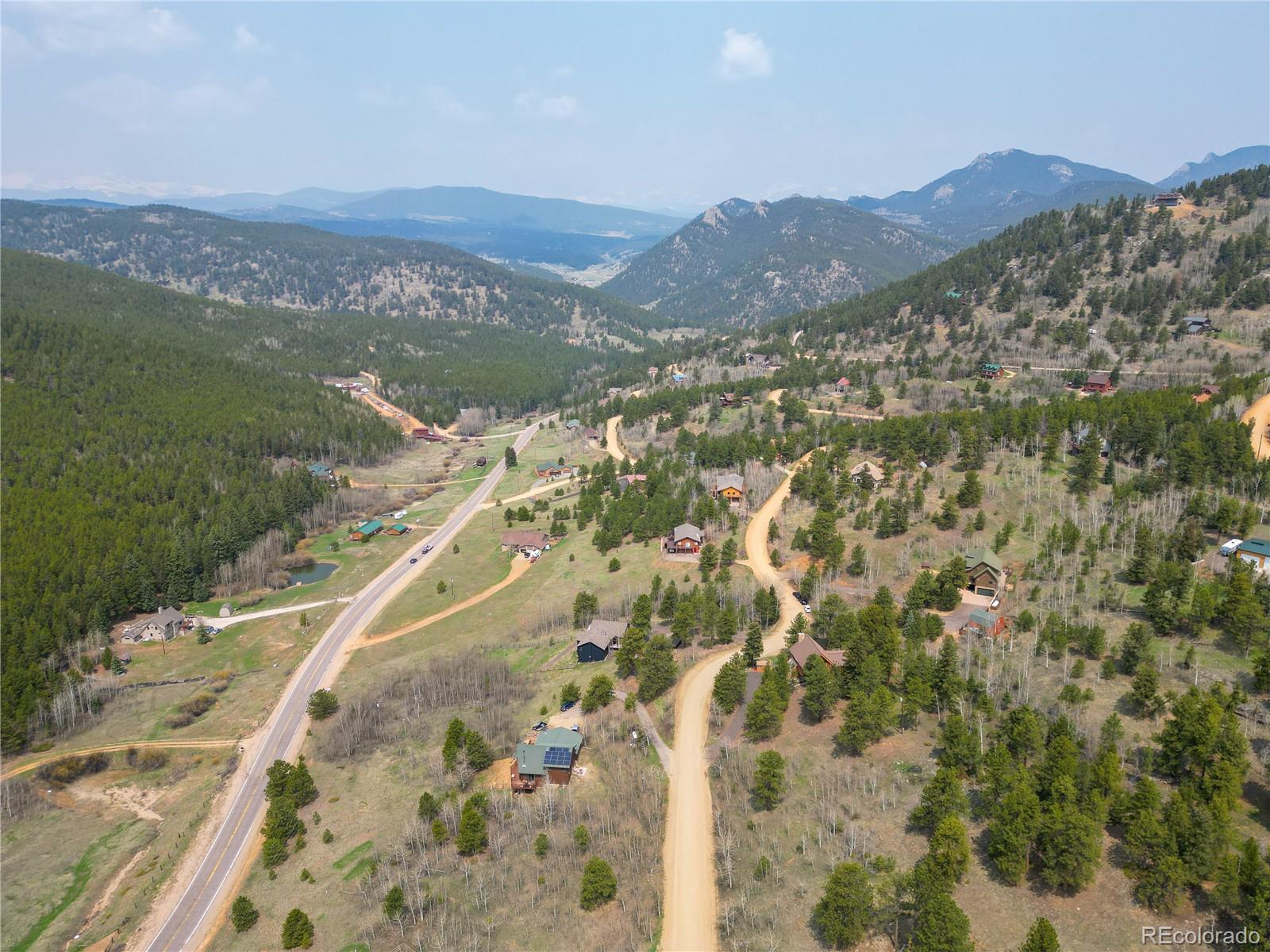 152 Bear Drive Golden, CO 80403 - Photo 6 of 40 a view of a city with mountains in the background