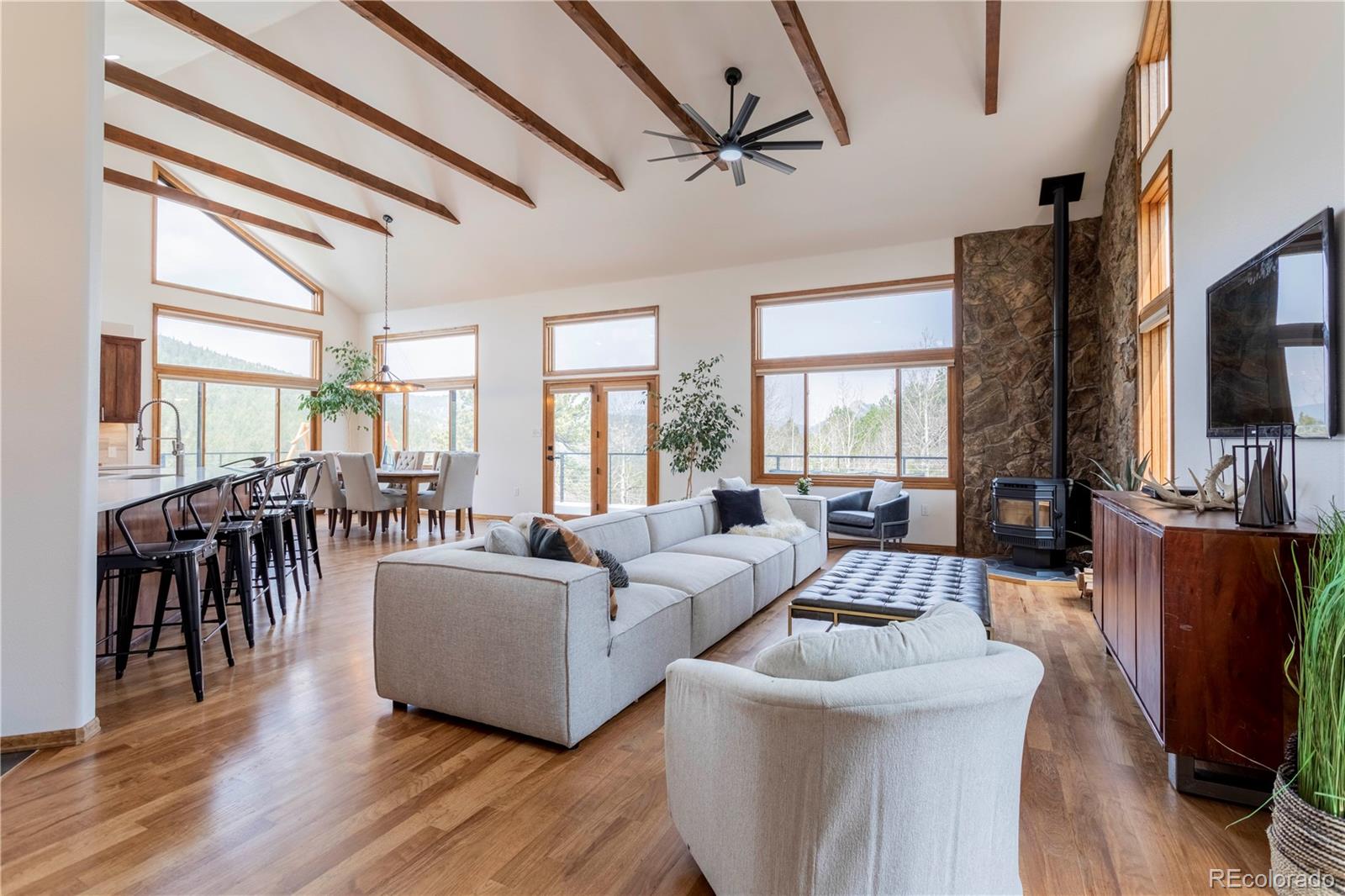 152 Bear Drive Golden, CO 80403 - Photo 7 of 40 a living room with fireplace furniture and a flat screen tv