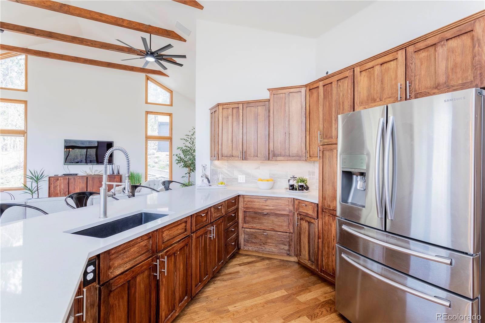 152 Bear Drive Golden, CO 80403 - Photo 10 of 40 a kitchen with stainless steel appliances a refrigerator and a sink
