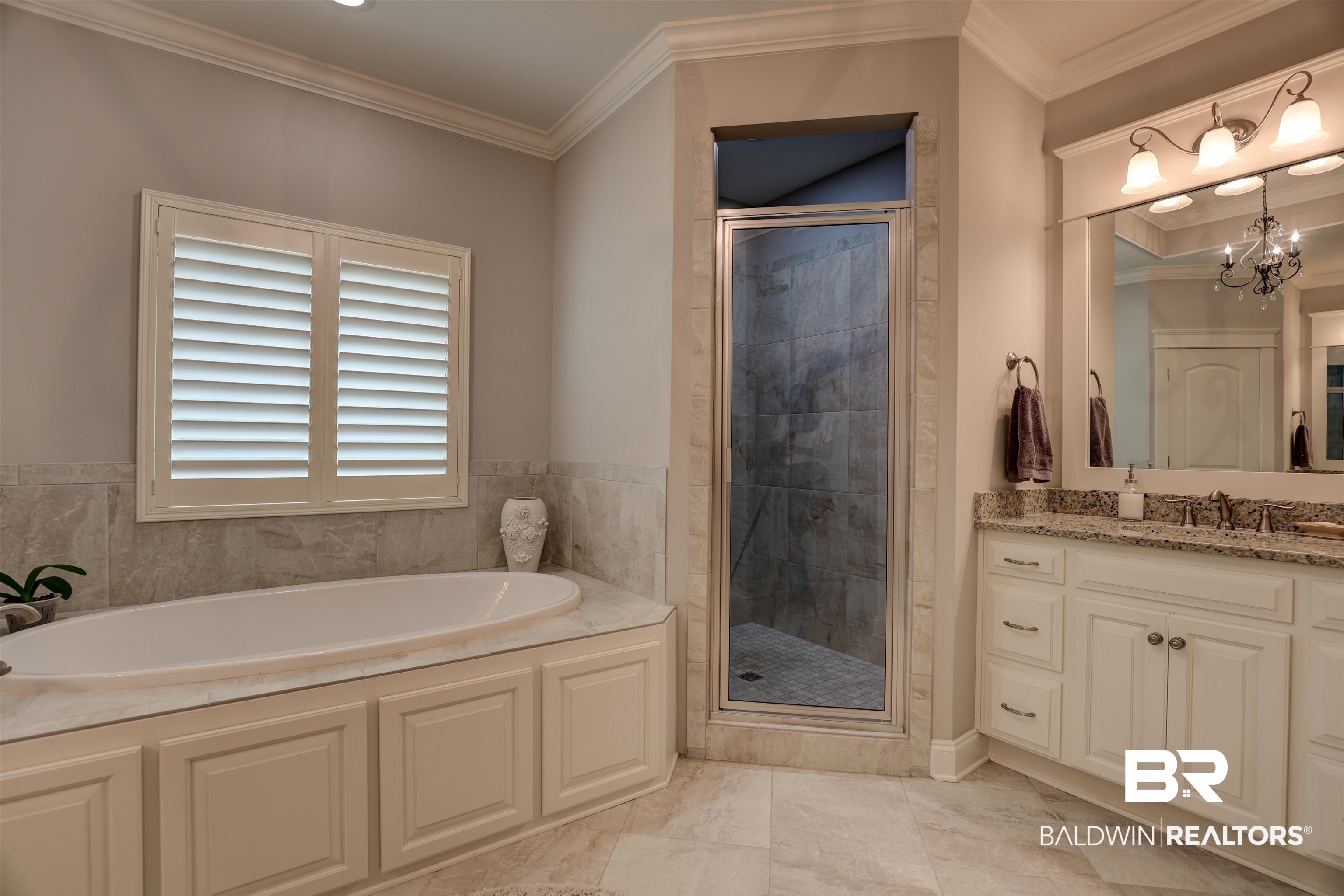 10588 Leesburg Pike Daphne, AL 36526 - Photo 17 of 29 Bathroom with crown molding, shower with separate bathtub, tile patterned floors, vanity, and a chandelier