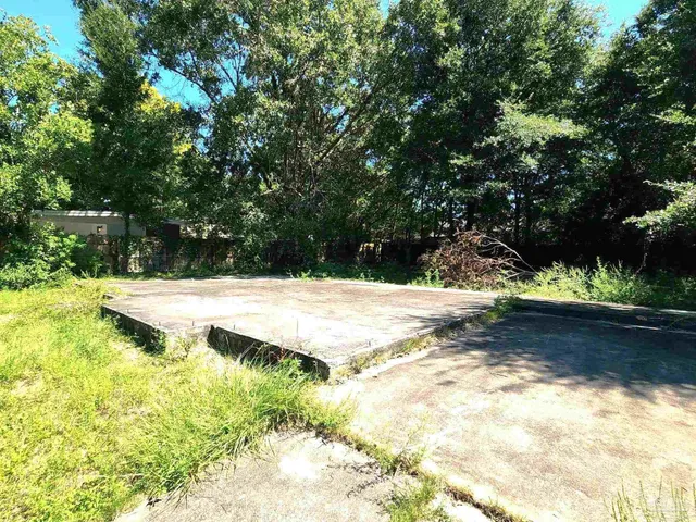 a view of swimming pool with a yard