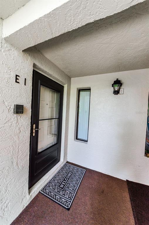 2575 Pine Ridge Way South, Unit E1 Palm Harbor, FL 34684 - Photo 2 of 25