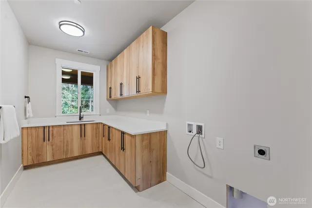 a bathroom with a granite countertop bathtub and shower