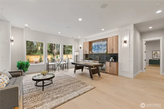 a living room with furniture a window and a table