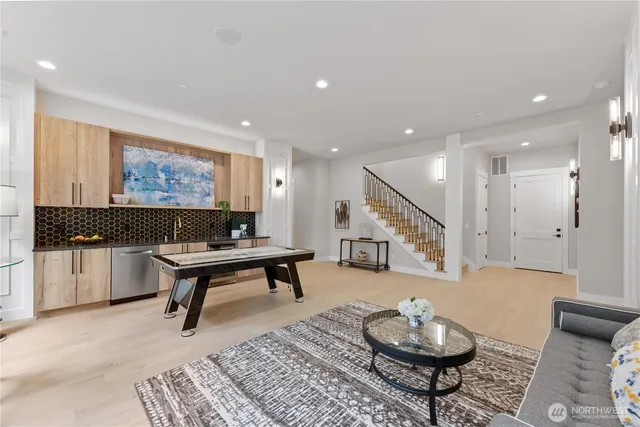 a living room with furniture and a rug