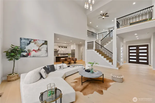 a living room with furniture and a potted plant