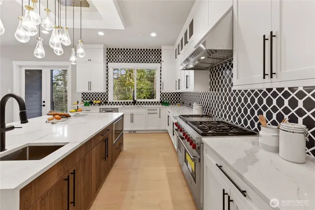 a kitchen with a stove and a sink