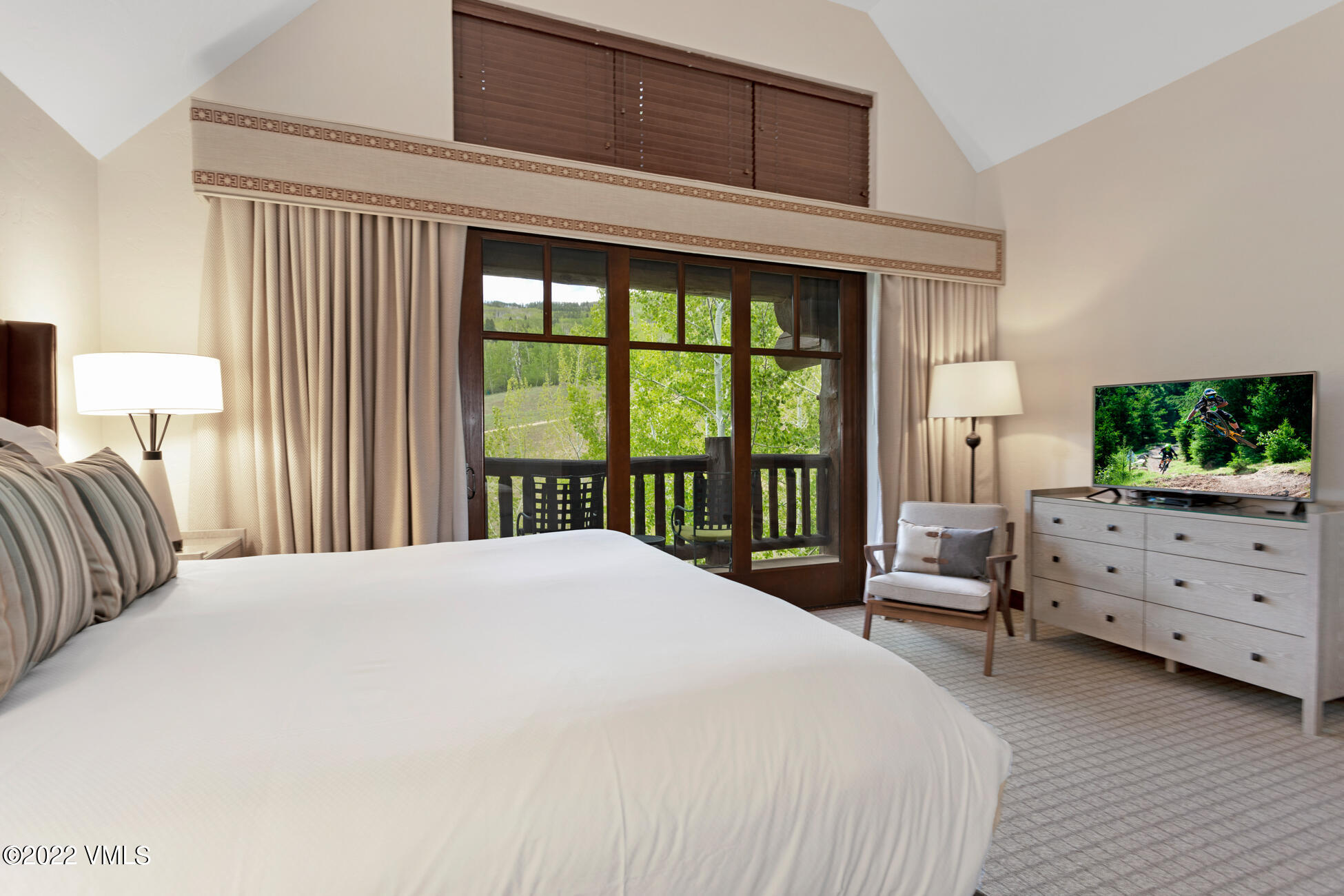 100 Bachelor Ridge Road, Unit 3704 Avon, CO 81620 - Photo 12 of 41 a bedroom with a bed and large windows