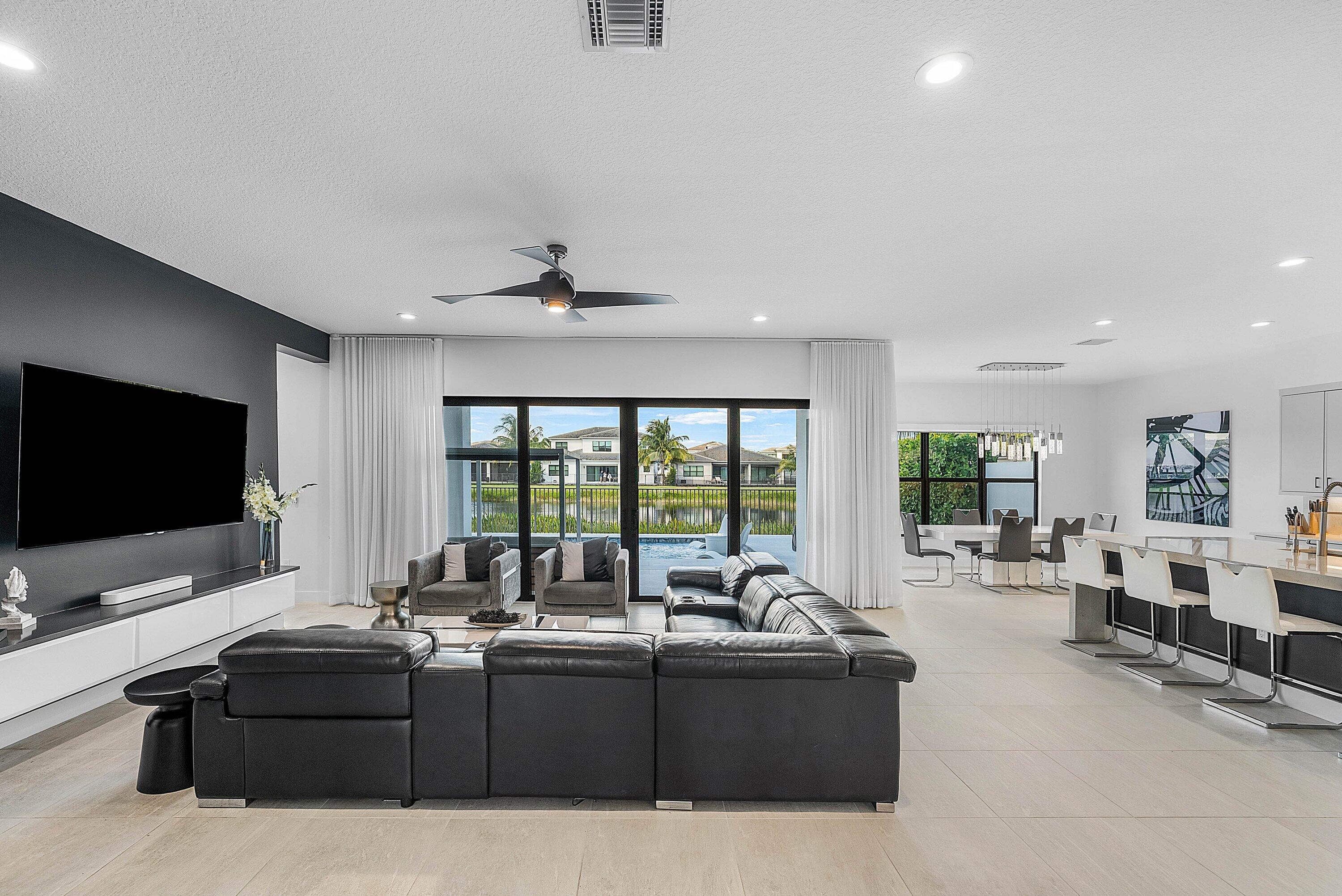 8805 New River Falls Road Boca Raton, FL 33496 - Photo 10 of 79 a living room with furniture and a flat screen tv