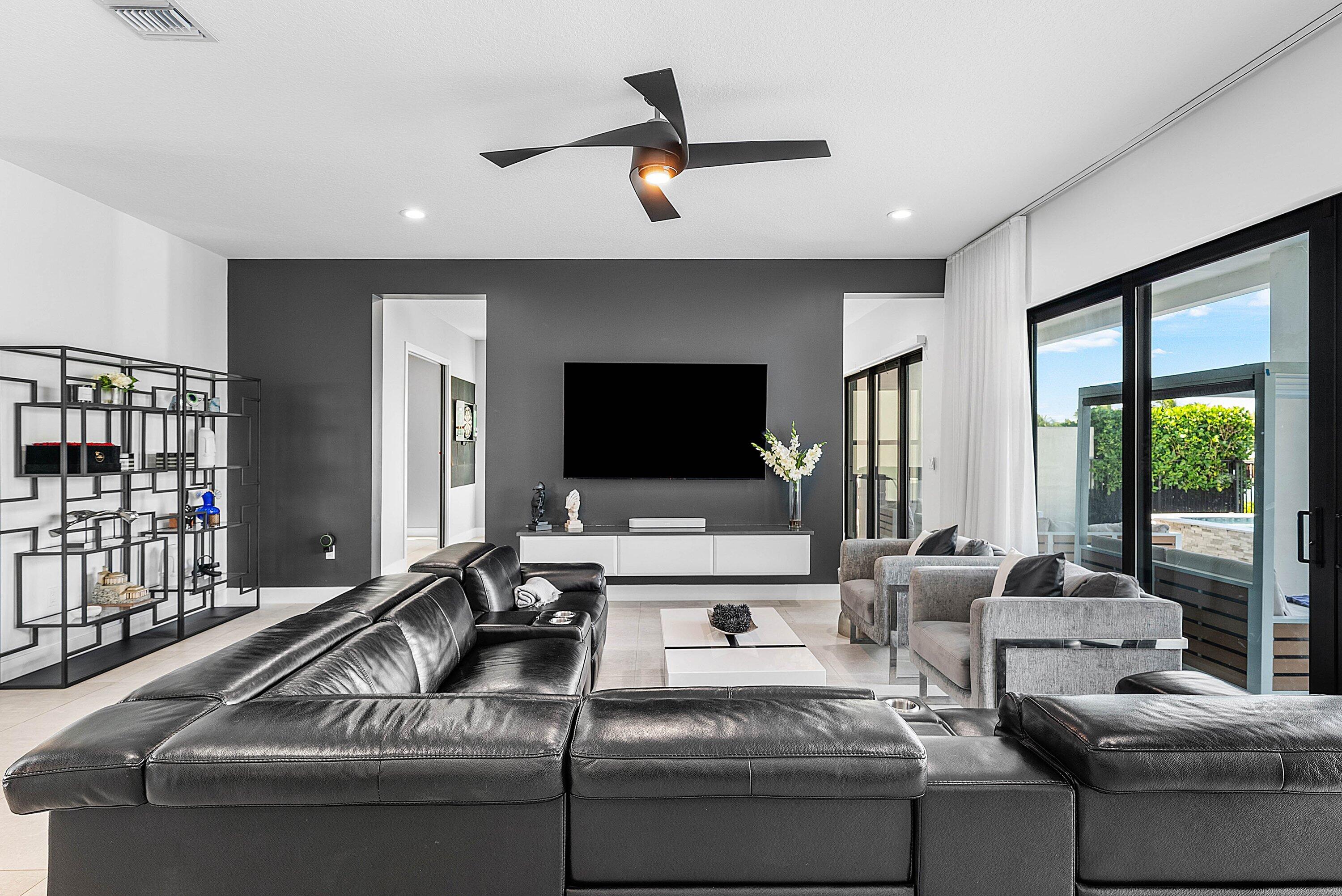 8805 New River Falls Road Boca Raton, FL 33496 - Photo 13 of 79 a living room with furniture and a flat screen tv