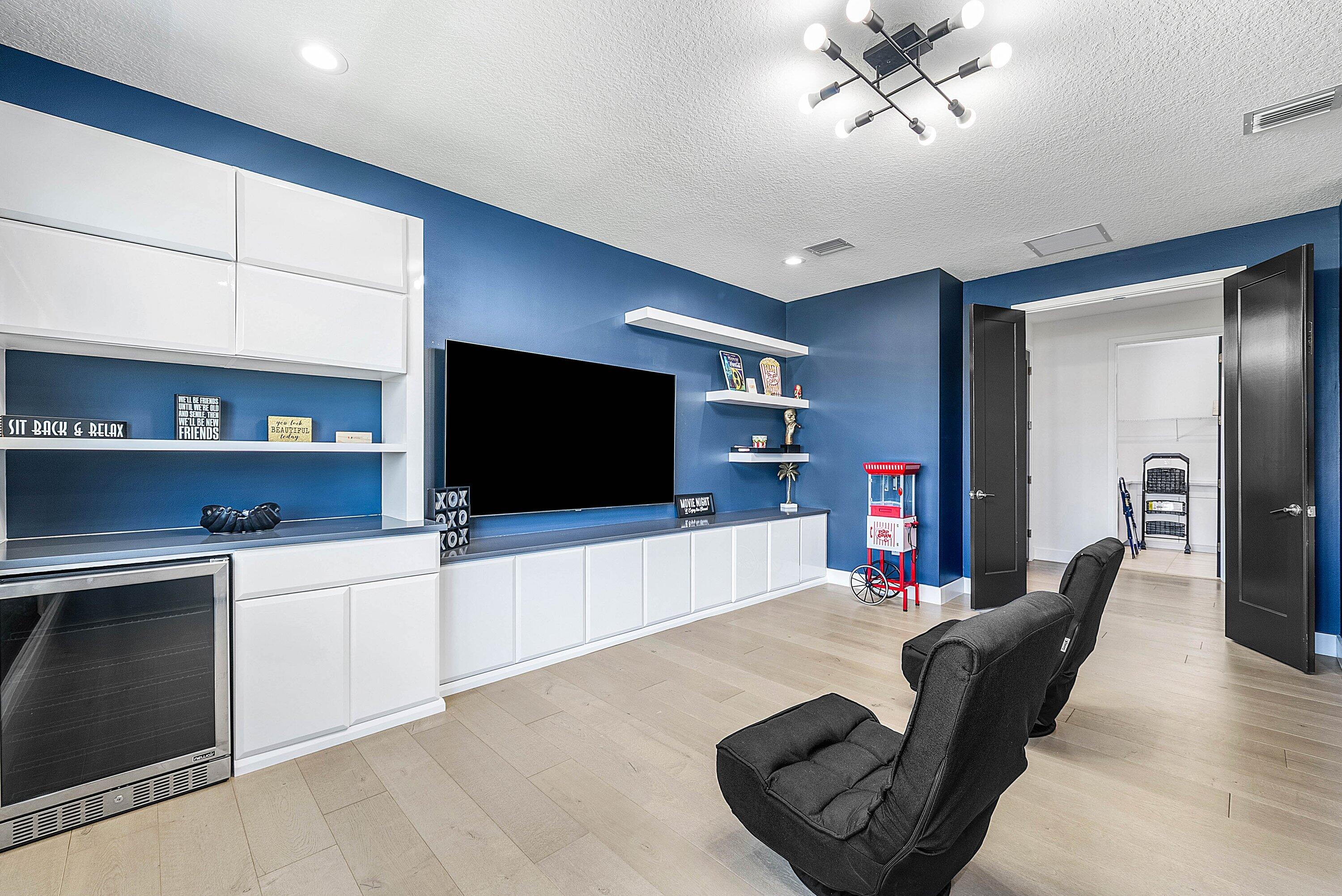 8805 New River Falls Road Boca Raton, FL 33496 - Photo 37 of 79 a living room with furniture and a flat screen tv