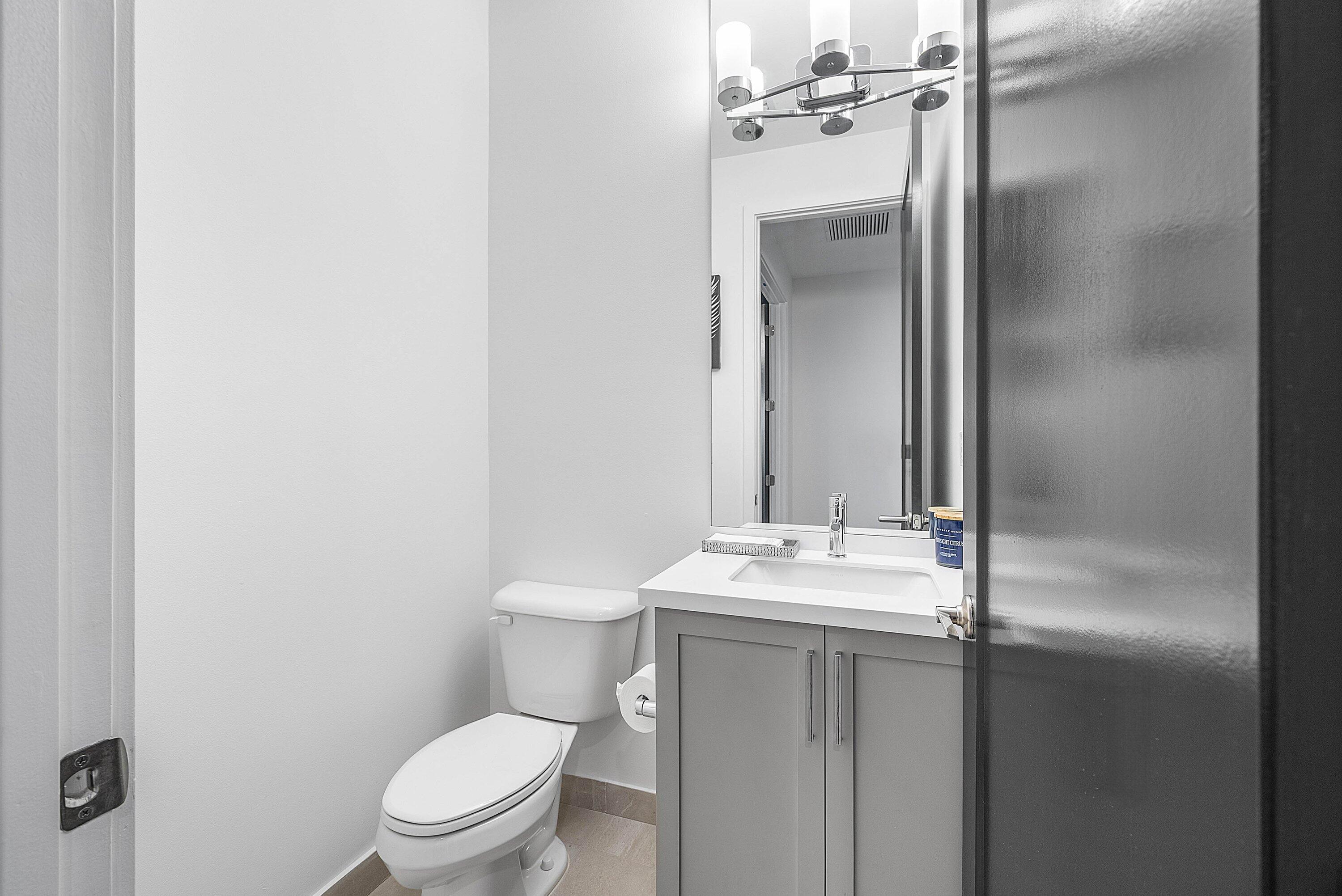 8805 New River Falls Road Boca Raton, FL 33496 - Photo 39 of 79 a bathroom with a granite countertop sink mirror vanity and toilet