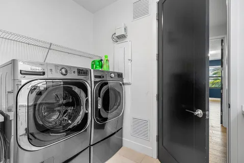 a view of a house with swimming pool and sitting area