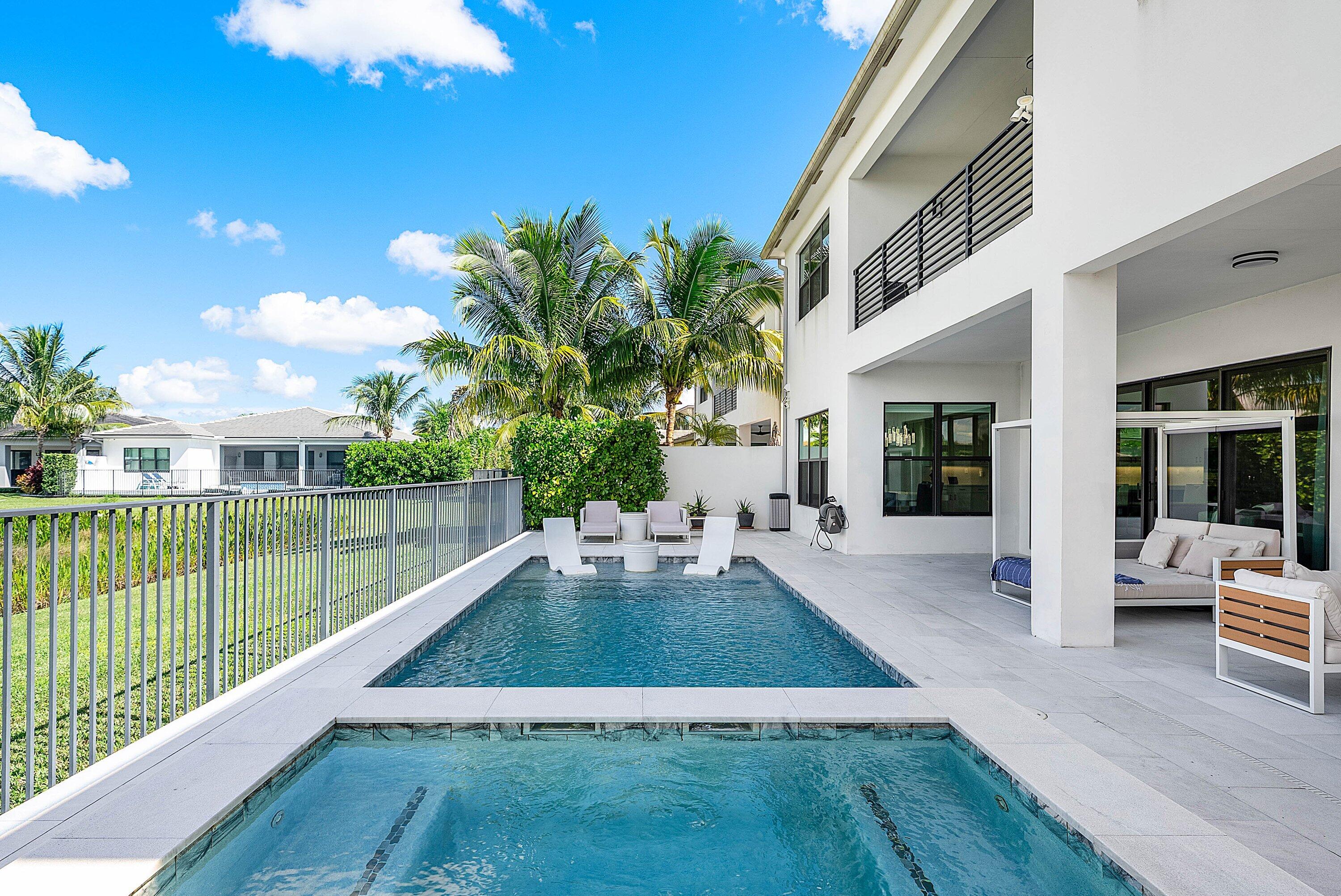 8805 New River Falls Road Boca Raton, FL 33496 - Photo 55 of 79 a view of a house with backyard porch and sitting area