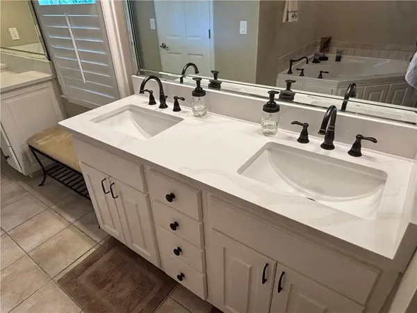 a kitchen with stainless steel appliances a refrigerator and a stove top oven