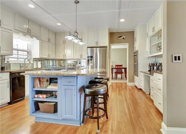 a view of a dining room with furniture and wooden floor