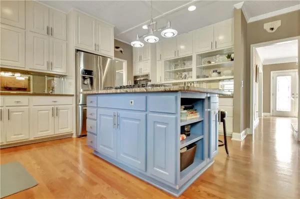 a view of a balcony with furniture and wooden floor