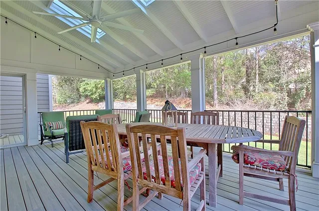 a view of a yard with wooden fence