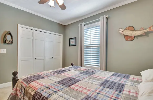 a bathroom with a granite countertop toilet sink and mirror