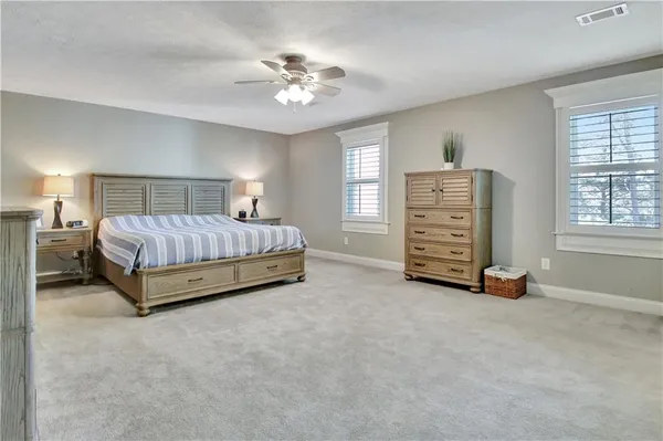 a kitchen with stainless steel appliances granite countertop a refrigerator and a stove