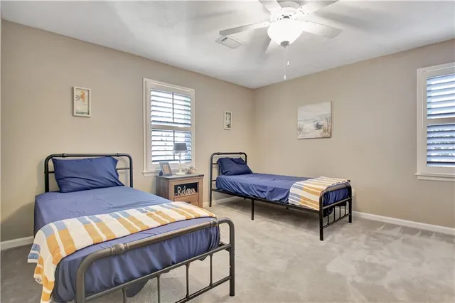 a kitchen with stainless steel appliances granite countertop a refrigerator and a stove