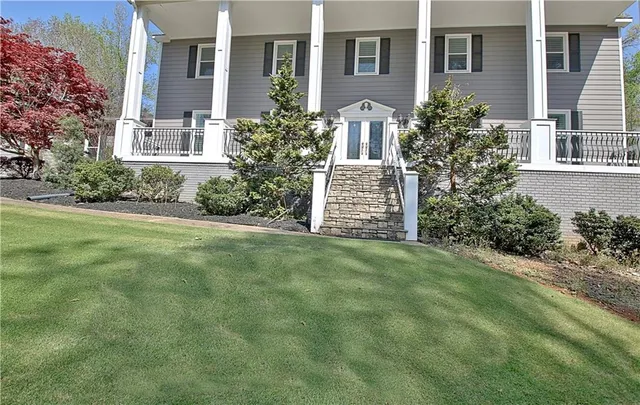 front view of a house with a yard