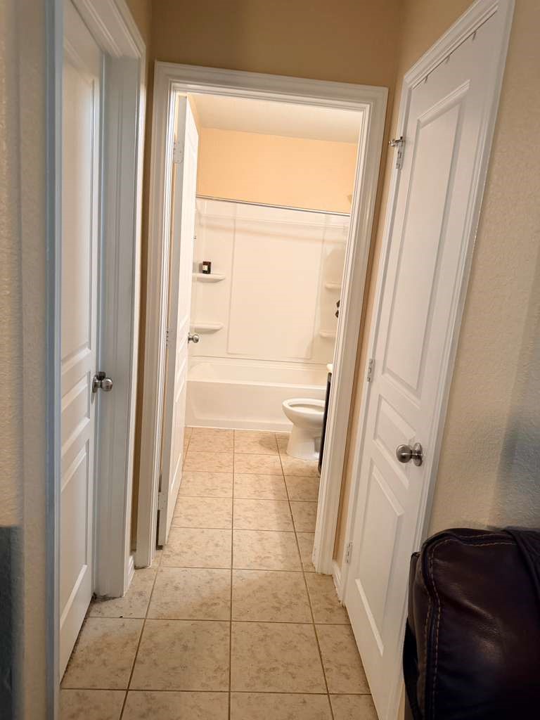 931 Salado Slough Lane Rosenberg, TX 77471 - Photo 11 of 17 a bathroom with a tub and a glass door shower