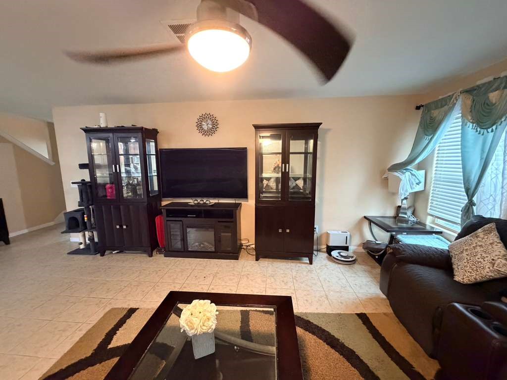 931 Salado Slough Lane Rosenberg, TX 77471 - Photo 15 of 17 a living room with furniture and a flat screen tv